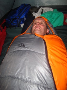 Dad bundled up in the mummy sleeping bag in our tent
