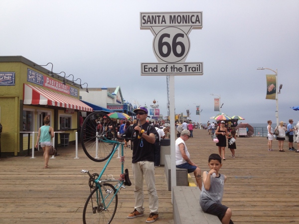 Bike riders ending their trip at the end of the trail on Santa Monica Pier
